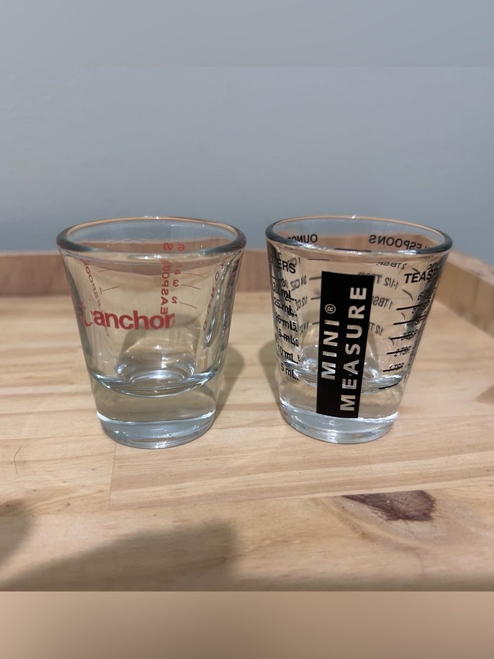 Clear Shot Glass Pair with Red and Black Logos